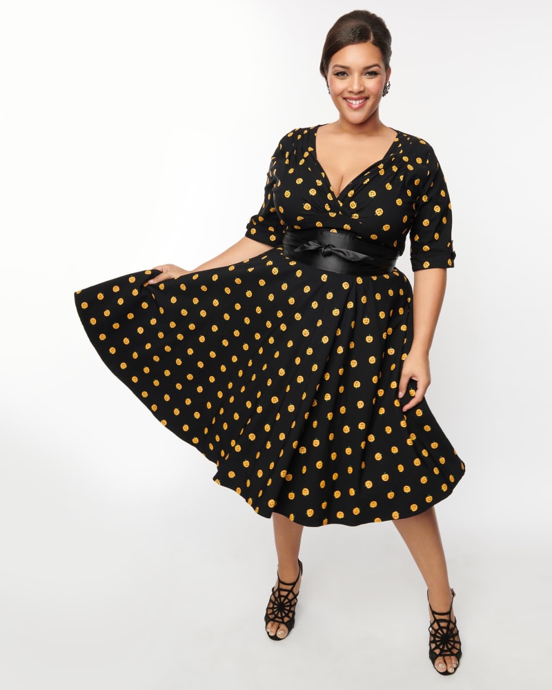 Front of a model wearing a size L Unique Vintage Black & Pumpkin Delores Swing Dress in Black by Unique Vintage. | dia_product_style_image_id:301079